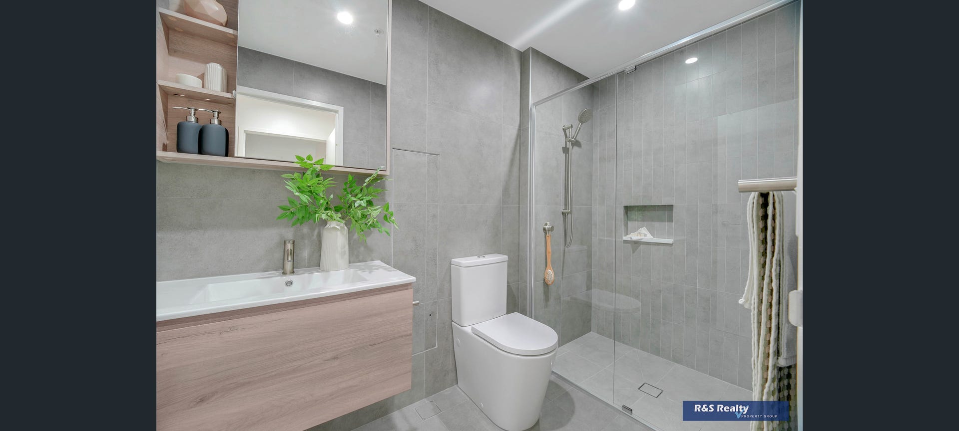 Premium bathroom with grey tiling and timber vanity