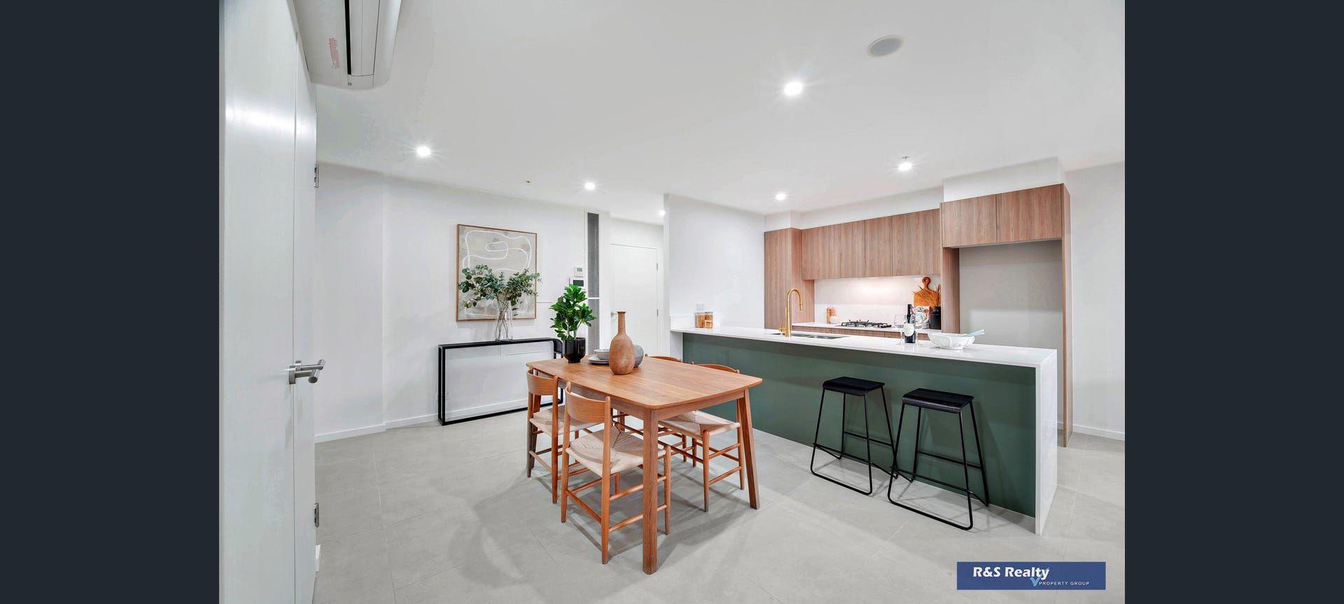 Designer kitchen with forest green island